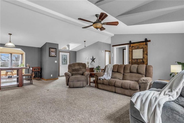 living area with a barn door, lofted ceiling with beams, ceiling fan, baseboards, and carpet flooring