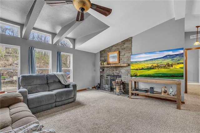 living area featuring a textured ceiling, visible vents, ceiling fan, a stone fireplace, and carpet floors