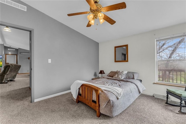 bedroom with vaulted ceiling, visible vents, baseboards, and carpet