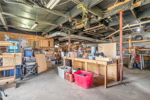 unfinished below grade area featuring a workshop area