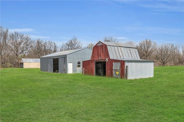 view of barn featuring a yard