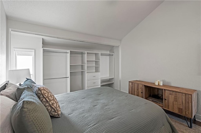 bedroom featuring a closet and vaulted ceiling