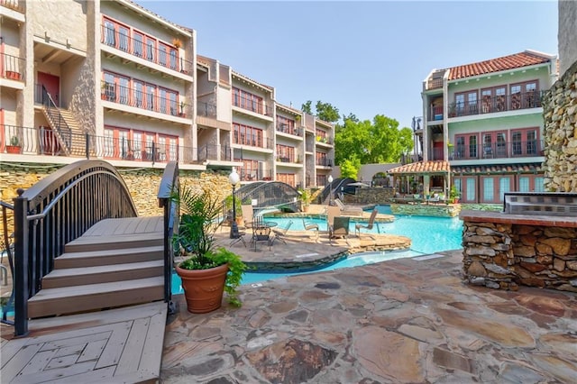 community pool featuring a patio area