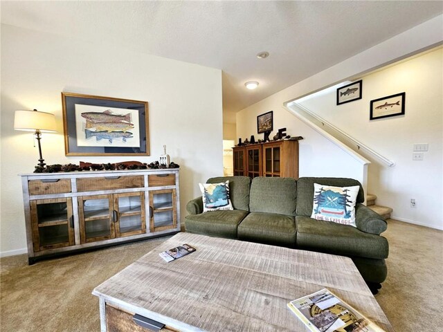 528 W End Cir, Osage Beach, MO 65065 - carpeted living room featuring stairway and baseboards