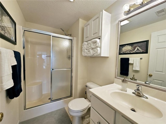 528 W End Cir, Osage Beach, MO 65065 - full bathroom featuring a stall shower, vanity, toilet, and a textured ceiling