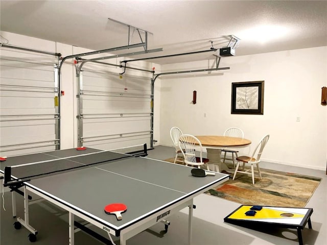 528 W End Cir, Osage Beach, MO 65065 - rec room with a garage and a textured ceiling