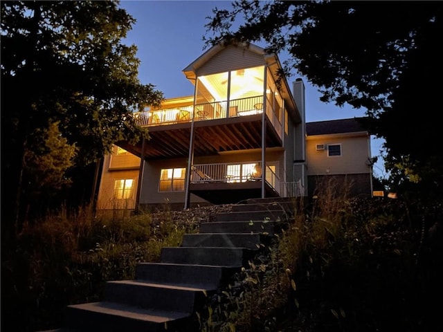 528 W End Cir, Osage Beach, MO 65065 - back of house featuring stairway and a chimney