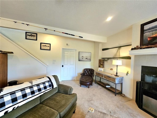 528 W End Cir, Osage Beach, MO 65065 - living room featuring carpet floors, a tile fireplace, and a textured ceiling