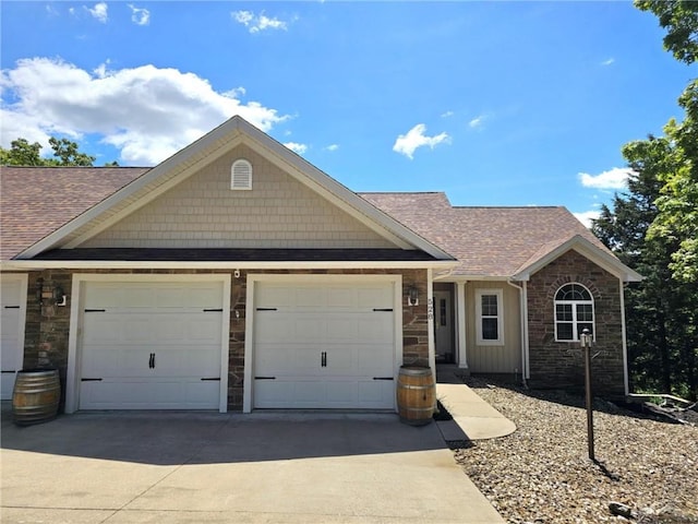 528 W End Cir, Osage Beach, MO 65065 - view of front of house featuring driveway, stone siding, a garage, and roof with shingles