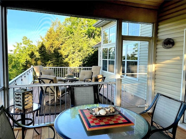 528 W End Cir, Osage Beach, MO 65065 - view of wooden balcony featuring outdoor dining area and a wooden deck