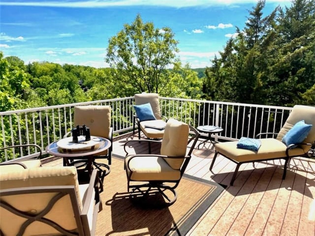 528 W End Cir, Osage Beach, MO 65065 - wooden deck featuring a forest view