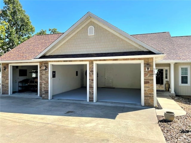 528 W End Cir, Osage Beach, MO 65065 - garage featuring concrete driveway
