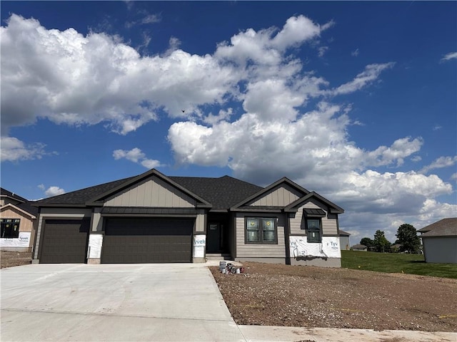 2005 Foxtail Pt, Kearney, MO 64060 - view of front of house featuring an attached garage, driveway, and board and batten siding
