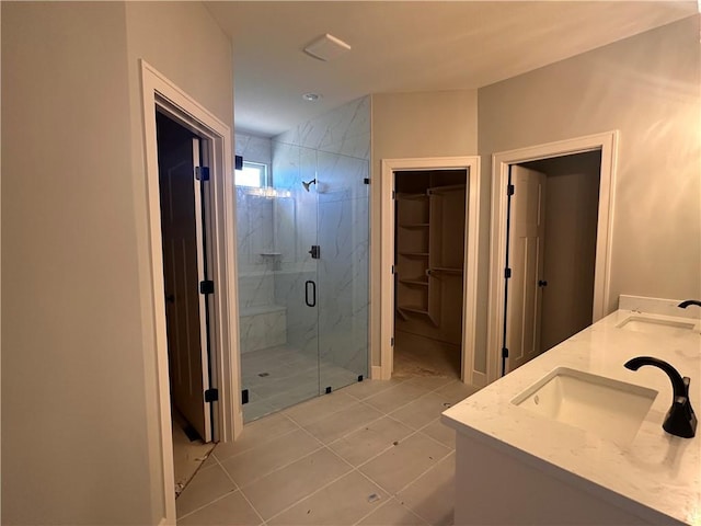 2005 Foxtail Pt, Kearney, MO 64060 - bathroom with a marble finish shower, a walk in closet, and double vanity