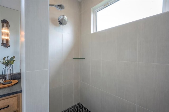 full bathroom with tiled shower
