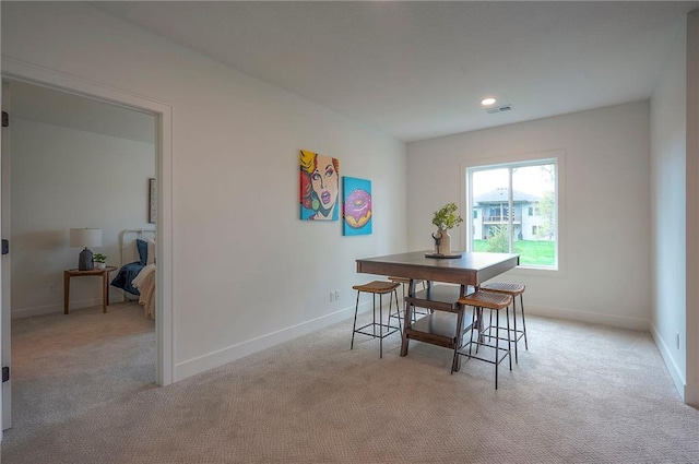 dining area featuring recessed lighting, visible vents, light carpet, and baseboards