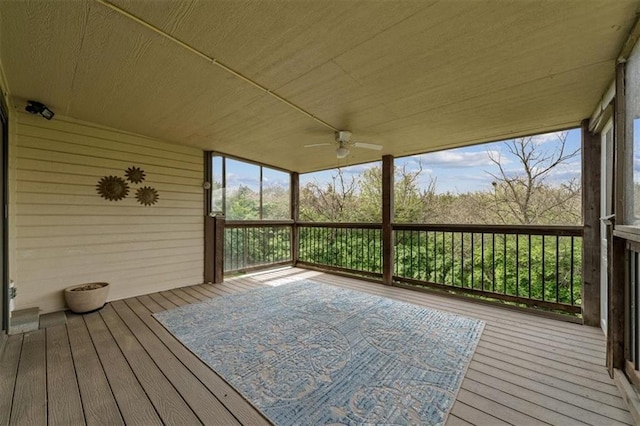 wooden deck with a ceiling fan