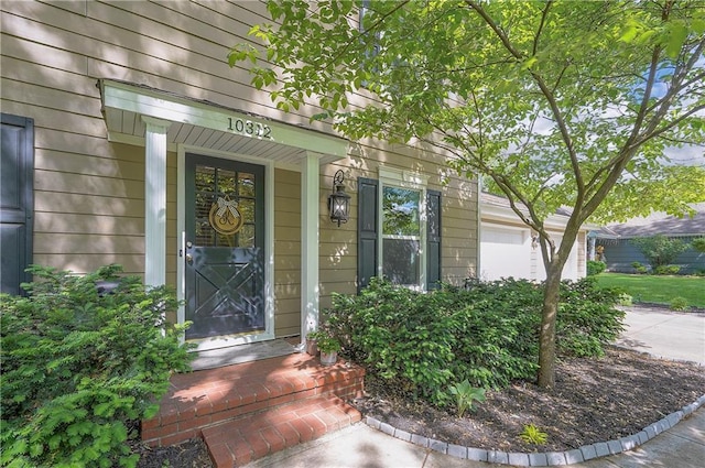 10312 Lamar Ave, Overland Park, KS 66207 - property entrance featuring driveway and covered porch