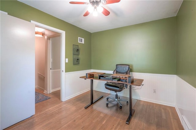 10312 Lamar Ave, Overland Park, KS 66207 - office area featuring a wainscoted wall, wood finished floors, and a ceiling fan