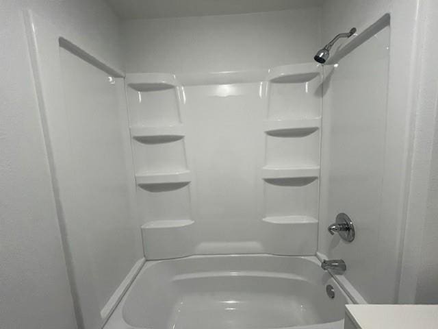 full bathroom featuring bathtub / shower combination and vanity