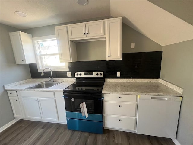 kitchen featuring white cabinetry, range with electric stovetop, a sink, and dark wood-style flooring
