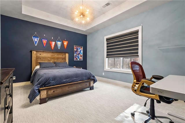 carpeted bedroom featuring a desk and baseboards
