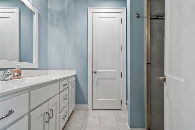 full bathroom featuring vanity and tile patterned floors