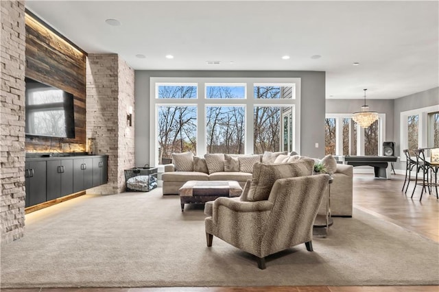 living room featuring wood finished floors and recessed lighting