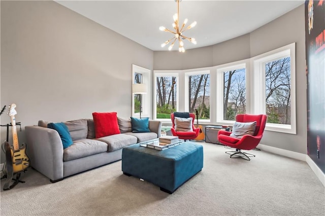 living room with carpet, a chandelier, and baseboards