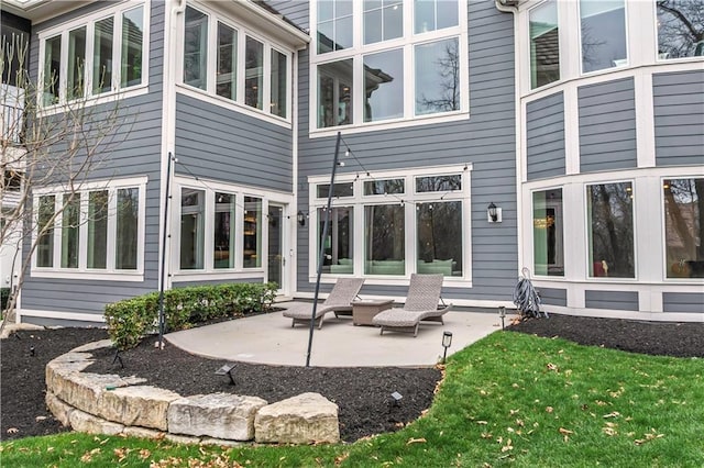 back of house with a patio