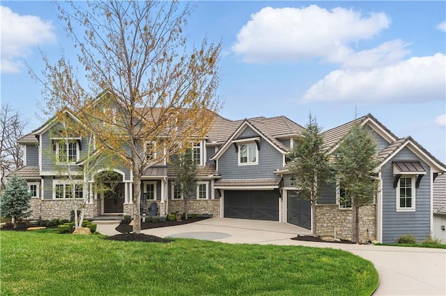 16401 W Loch Lloyd Pkwy, Loch Lloyd, MO 64012 - view of front of house with stone siding, a garage, driveway, and a front lawn