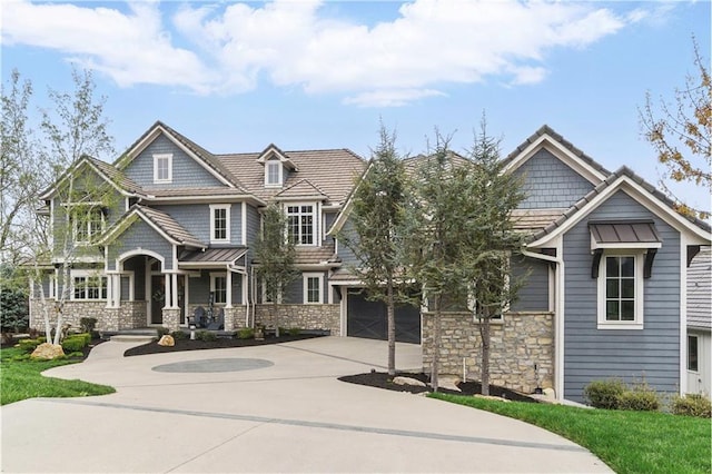 16401 W Loch Lloyd Pkwy, Loch Lloyd, MO 64012 - craftsman house featuring concrete driveway, stone siding, and an attached garage