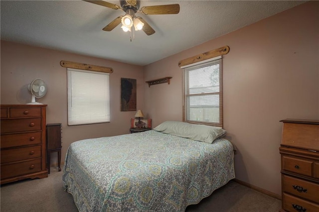 bedroom featuring carpet floors and a ceiling fan