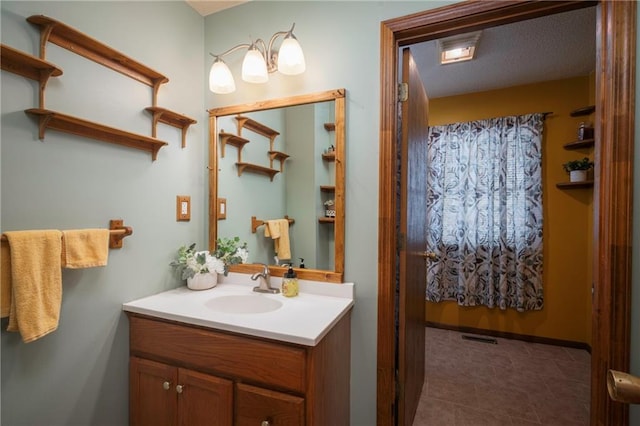 full bathroom featuring visible vents and vanity