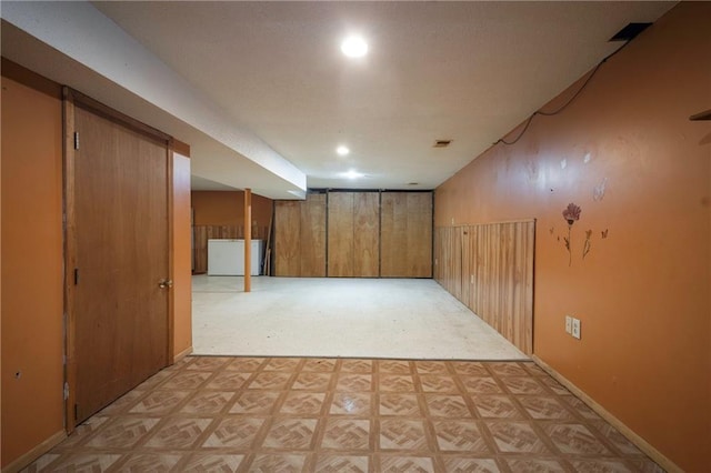 interior space with recessed lighting, baseboards, visible vents, and light floors