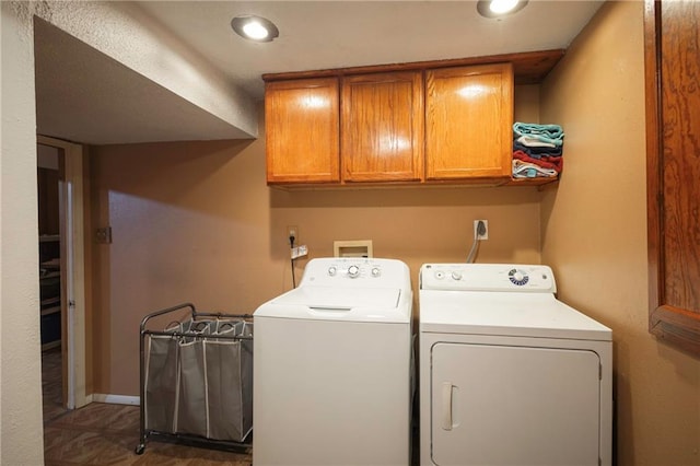 washroom with cabinet space, recessed lighting, and washing machine and dryer