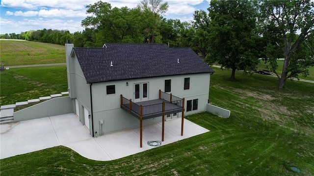 31201 E Lone Jack Lees Summit Rd, Lees Summit, MO 64086 - rear view of house featuring a lawn, a shingled roof, concrete driveway, and a chimney