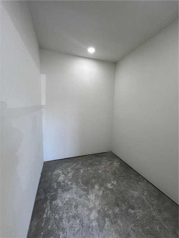 empty room featuring recessed lighting and concrete flooring