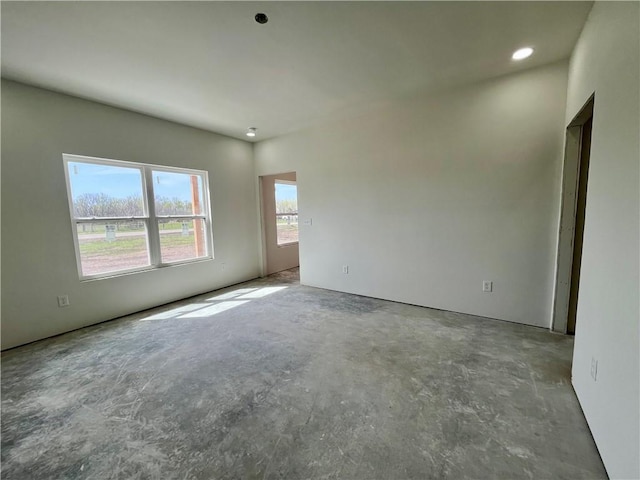 spare room with concrete floors