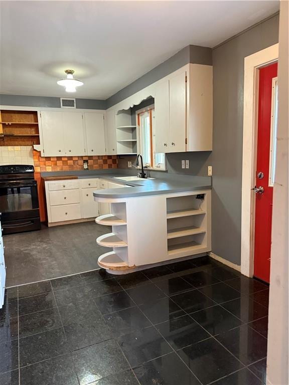1020 Francis St, Lexington, MO 64067 - kitchen with open shelves, a sink, backsplash, white cabinetry, and black range with electric stovetop