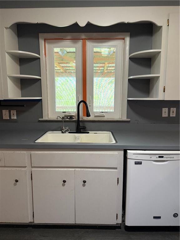 1020 Francis St, Lexington, MO 64067 - kitchen with open shelves, white dishwasher, white cabinets, and a sink