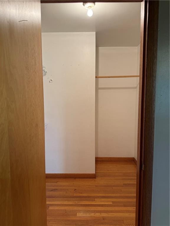1020 Francis St, Lexington, MO 64067 - walk in closet featuring light wood-type flooring