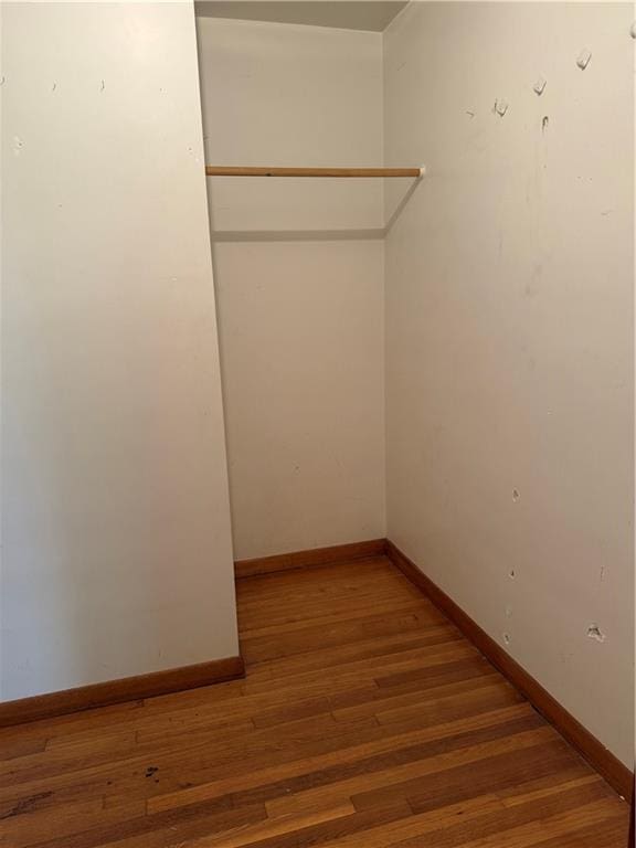 1020 Francis St, Lexington, MO 64067 - walk in closet with light wood finished floors