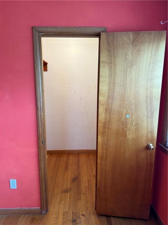1020 Francis St, Lexington, MO 64067 - hall featuring wood finished floors and baseboards