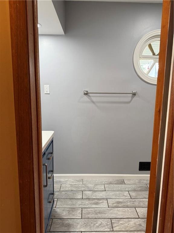 1020 Francis St, Lexington, MO 64067 - bathroom with wood finished floors and vanity