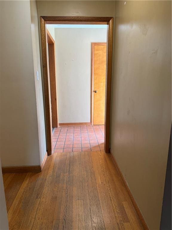 1020 Francis St, Lexington, MO 64067 - corridor with baseboards and wood finished floors