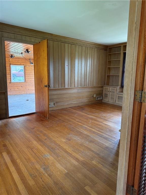 1020 Francis St, Lexington, MO 64067 - unfurnished room with wood walls and wood finished floors