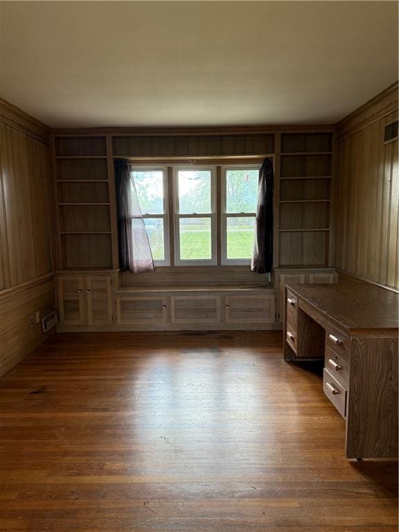1020 Francis St, Lexington, MO 64067 - unfurnished office with wooden walls, wood finished floors, and visible vents