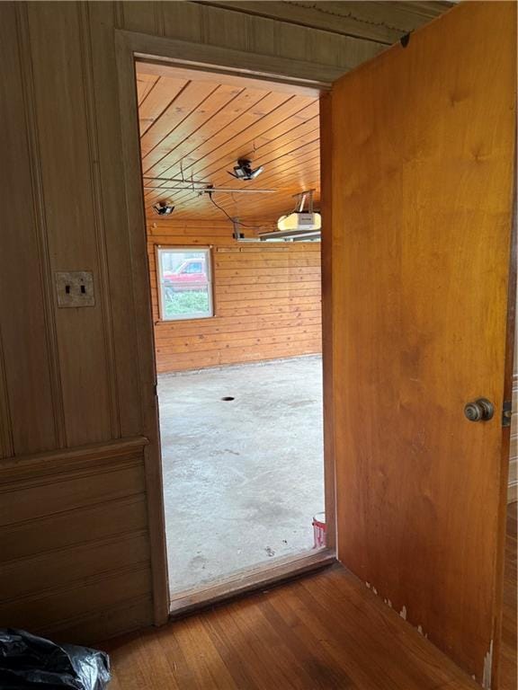 1020 Francis St, Lexington, MO 64067 - doorway with wood walls, wood finished floors, and wooden ceiling