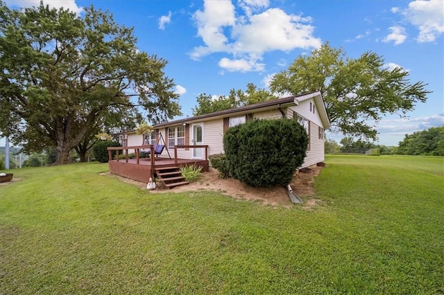 view of yard with a wooden deck